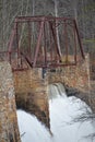 Spillway of Century Old Dam and Truss of Abandoned Bridge