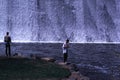 Father & son Trout fishing by a spillway Royalty Free Stock Photo