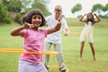 Spin like yourve never spun before. Three children playing with hula hoops outside. Royalty Free Stock Photo