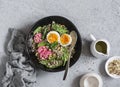 Spinach breakfast salad with quinoa, radish and egg. Healthy diet food concept. Royalty Free Stock Photo