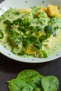 Spinach broccoli sauce with potato gnocchi vertical view.jpg