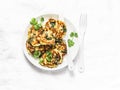 Spinach courgettes fritters - delicious vegetarian snacks, appetizers, breakfast on a light background