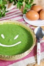 Spinach cream soup smile Royalty Free Stock Photo