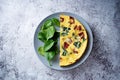 Spinach Dried tomatoes Frittata in a plate