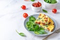 Spinach Dried tomatoes Frittata in a plate