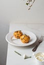 Spinach Feta cheese breakfast muffins on a plate. White marble background. Royalty Free Stock Photo