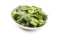 Spinach. Fresh baby spinach leaves in plate isolated on white Royalty Free Stock Photo