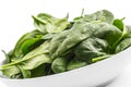 Spinach. Fresh baby spinach leaves in plate isolated on white Royalty Free Stock Photo