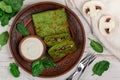 Spinach green pancakes crepes stuffed with mushroom