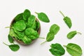 Spinach leaves in wooden bowl over white wooden table background. Vegan food trend. Green living concept. Top view. Royalty Free Stock Photo