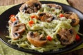 Spinach noodles with mushrooms and parmesan cheese close-up. horizontal