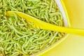 Closeup of Indian Spinach or palak sev in a bowl against isolated background