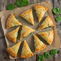 Spinach Pie Slices on Rustic Wooden Table Royalty Free Stock Photo