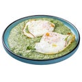 Spinach pottage with fried eggs
