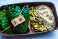 Spinach, pumpkin seeds, sesame on a white background. microelement FE. Close-up