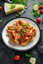 Spinach ricotta Ravioli in tomato sauce with wild rocket and parmesan cheese Royalty Free Stock Photo