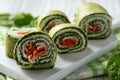 Spinach rolls with smoked salmon and cream cheese.