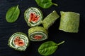 Spinach rolls with smoked salmon and cream cheese.