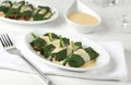 Spinach rolls with trout and cheese
