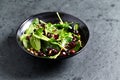 Spinach salad with dried cranberries and lemon-honey dressing