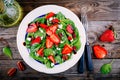 Spinach salad with strawberries, goat cheese, balsamic and walnuts
