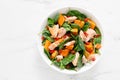 Spinach, salmon and sweetpotato festive thansgiving salad with paprika, top view