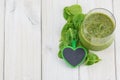 Spinach smoothie with a green heart.