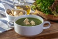 Spinach Soup with Bread in a White Bowl Royalty Free Stock Photo