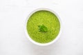 Spinach soup with green leaves in white plate Royalty Free Stock Photo