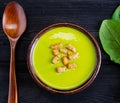 Spinach soup served on wooden board Royalty Free Stock Photo