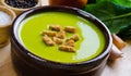 Spinach soup served on wooden board Royalty Free Stock Photo