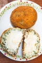 Spinach stuffed rice balls arancini on table