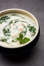 Spinach Yogurt Salad or Palak Raita served in a bowl