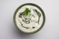 Spinach Yogurt Salad or Palak Raita served in a bowl