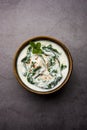 Spinach Yogurt Salad or Palak Raita served in a bowl