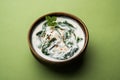 Spinach Yogurt Salad or Palak Raita served in a bowl