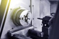 Spindle chuck and installed metal part on high precision Cnc industrial lathe turning machine. Close-up Royalty Free Stock Photo