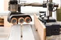 A Spindle moulder machine with power feed in a modern carpentry work shop used for cutting and shaping wood Royalty Free Stock Photo