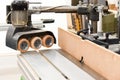 A Spindle moulder machine with power feed in a modern carpentry work shop used for cutting and shaping wood Royalty Free Stock Photo