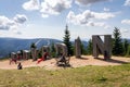 People with kids playing around big letters with beautiful summer landscape Royalty Free Stock Photo