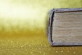 The spine of an old thick book lies on a yellow background. Library archive. History and memoirs. Educational and fiction