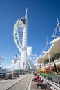 Spinnaker Tower and eateries located on the harbour front of Gunwharf Quay outlet shopping centre in Portsmouth, Hampshire, UK