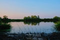 Spinning with a coil for evening fishing on the lake or river. Royalty Free Stock Photo