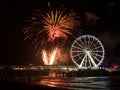 Spinning Ferris Wheel and international fireworks competition at the beach in Scheveningen, the Netherlands Royalty Free Stock Photo