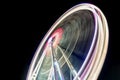 Spinning ferris wheel at night. Long exposure abstract image Royalty Free Stock Photo