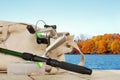 Spinning fishing equipment on a dock in the autumn Royalty Free Stock Photo