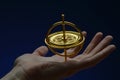 Spinning gyroscope balanced in man's palm