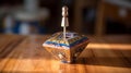 Spinning Hanukkah Dreidel on Wooden Surface