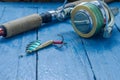Spinning and iron bait for fishing. Spoon. Water drops. Decorative background.