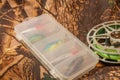 spinning lures in the box and fishing reel Royalty Free Stock Photo